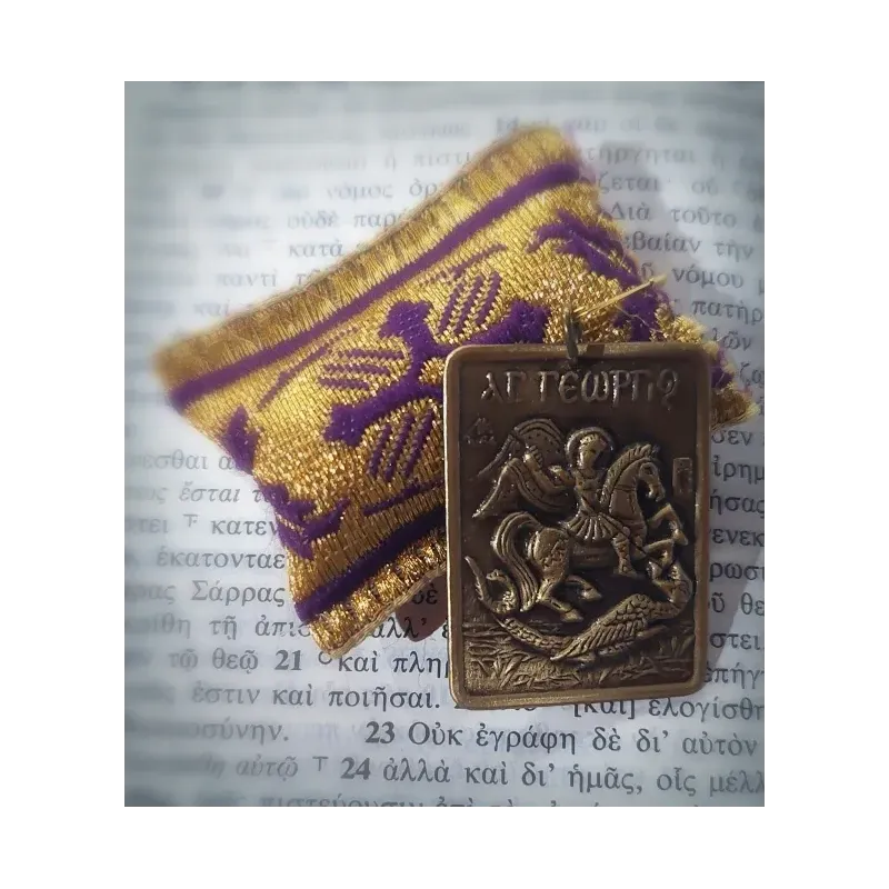 Ochranný přívěsek s kovovou ikonkou sv. Jiří bojujícího s drakem